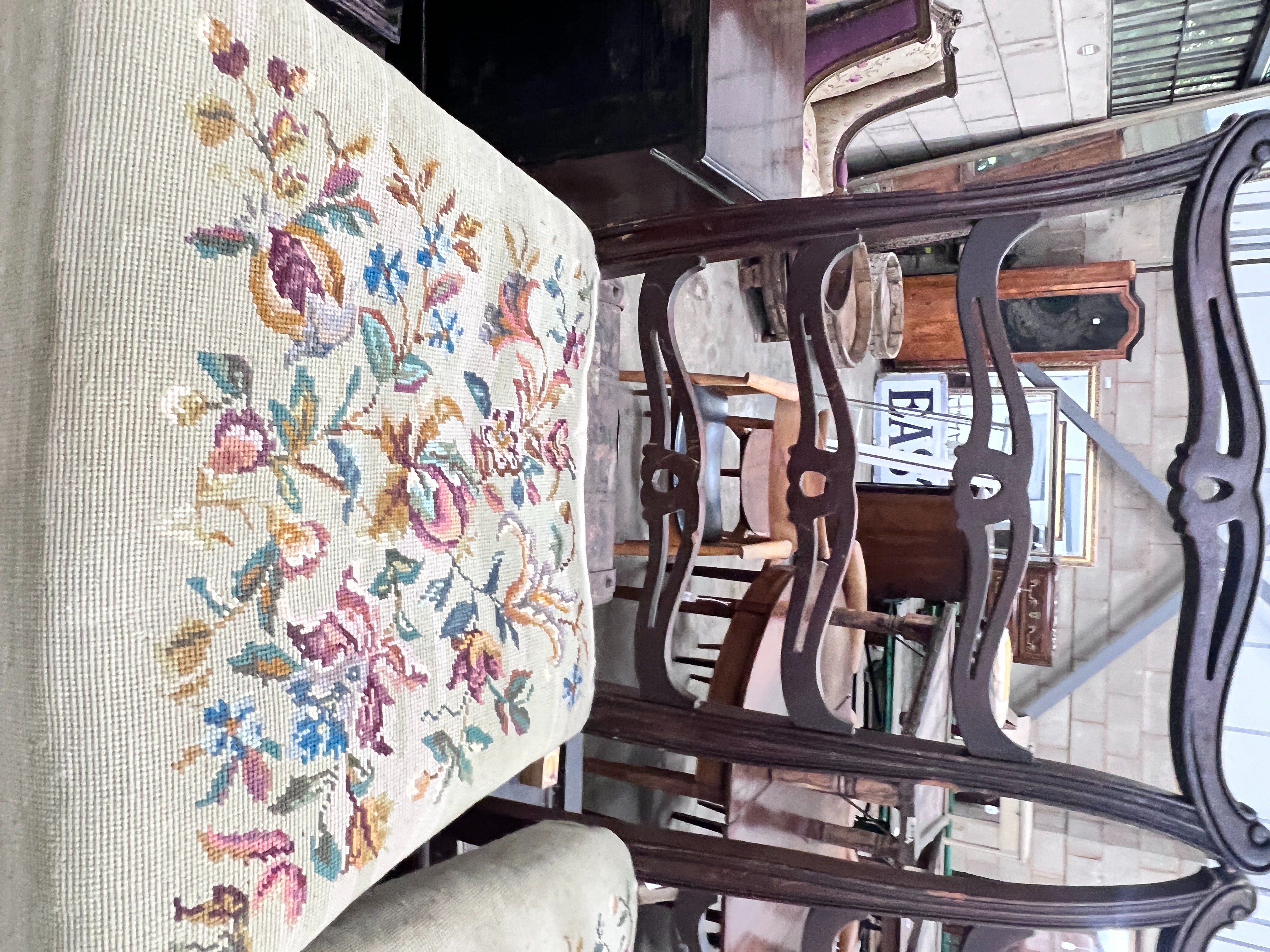 A 19th century and later D end extending dining table 176cm extended 1 spare leaf and six George III style pierced ladderback chairs, 2 with arms.